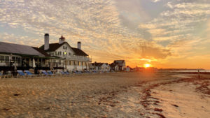 Relax on the beach at sunset after exploring Cape Cod towns.