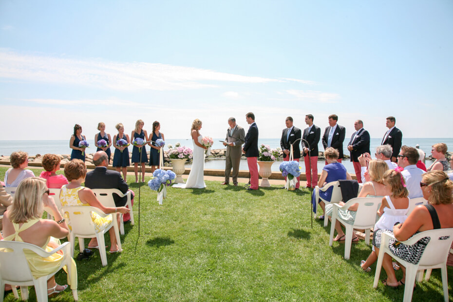 An outdoor oceanfront New England wedding ceremony at a Cape Cod venue.