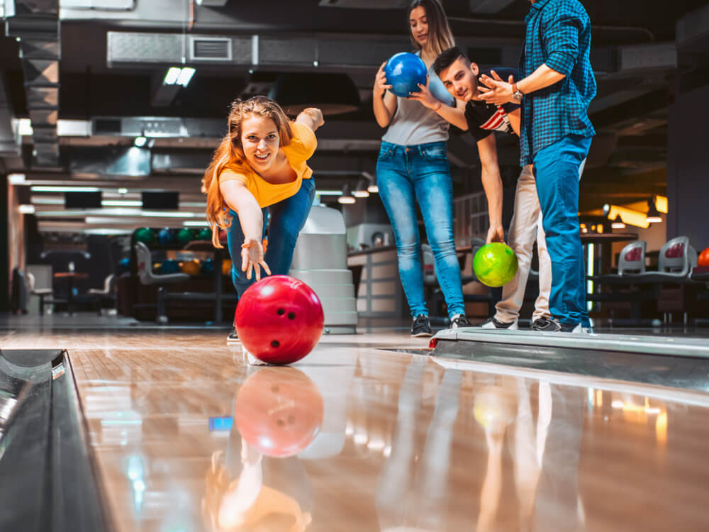 A group bowling at a nearby spot while on a corporate retreat at a Cape Cod resort.