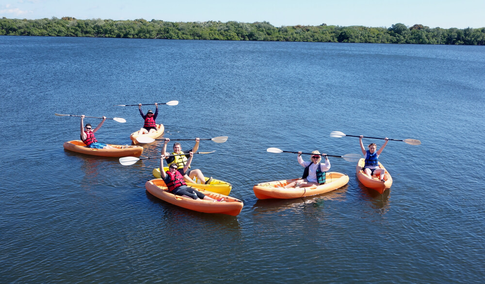 A group kayaking, one of the best Cape Cod family activities to enjoy on a reunion trip.