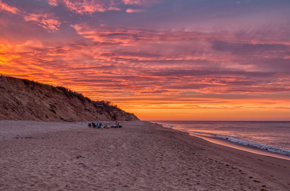 People enjoying a Cape Cod sunset at Cape Cod National Seashore.