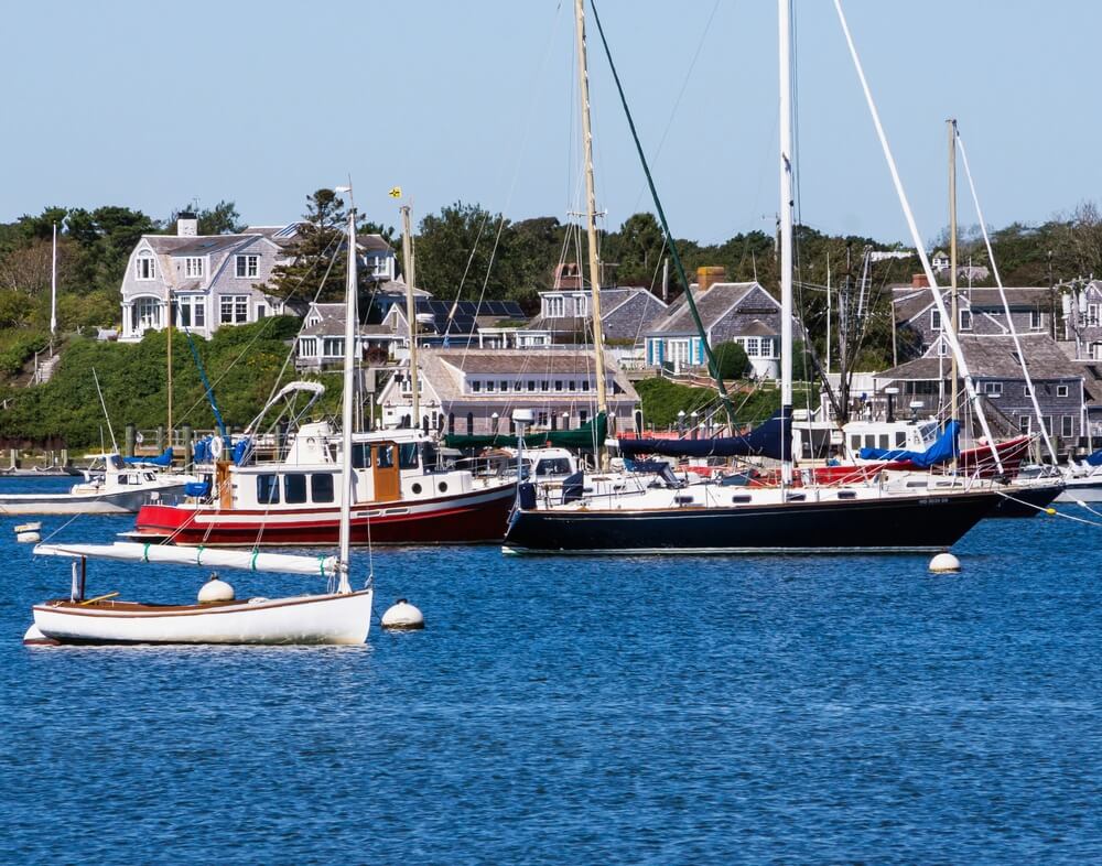 A view of boats in the water in one of the towns on Cape Cod with a European feel.